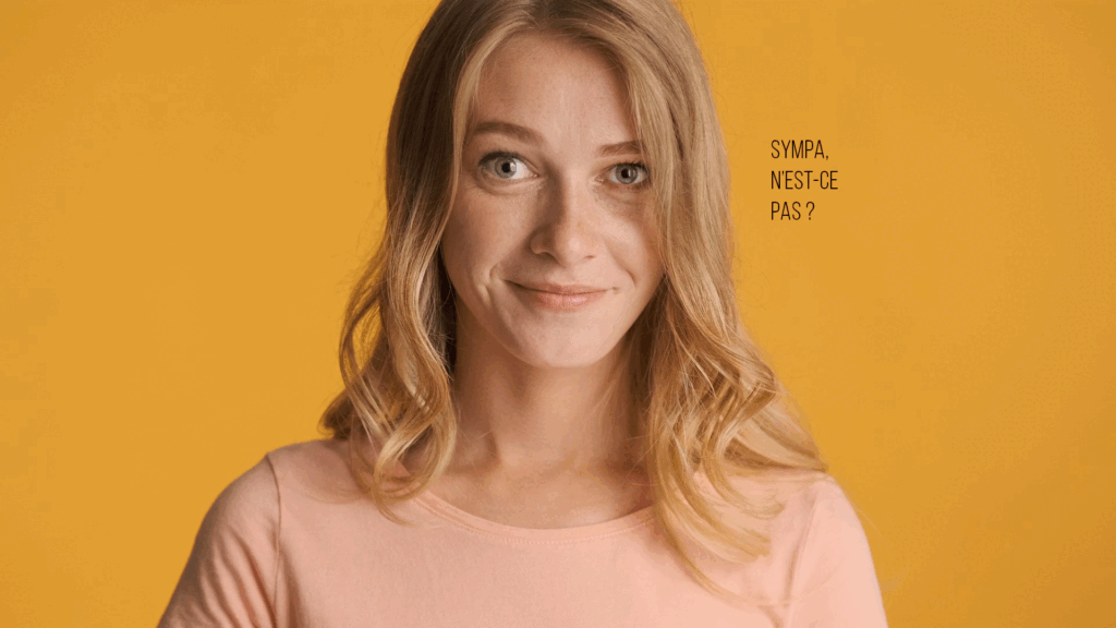 gif animé jeune femme sur fond jaune clin d'oeil